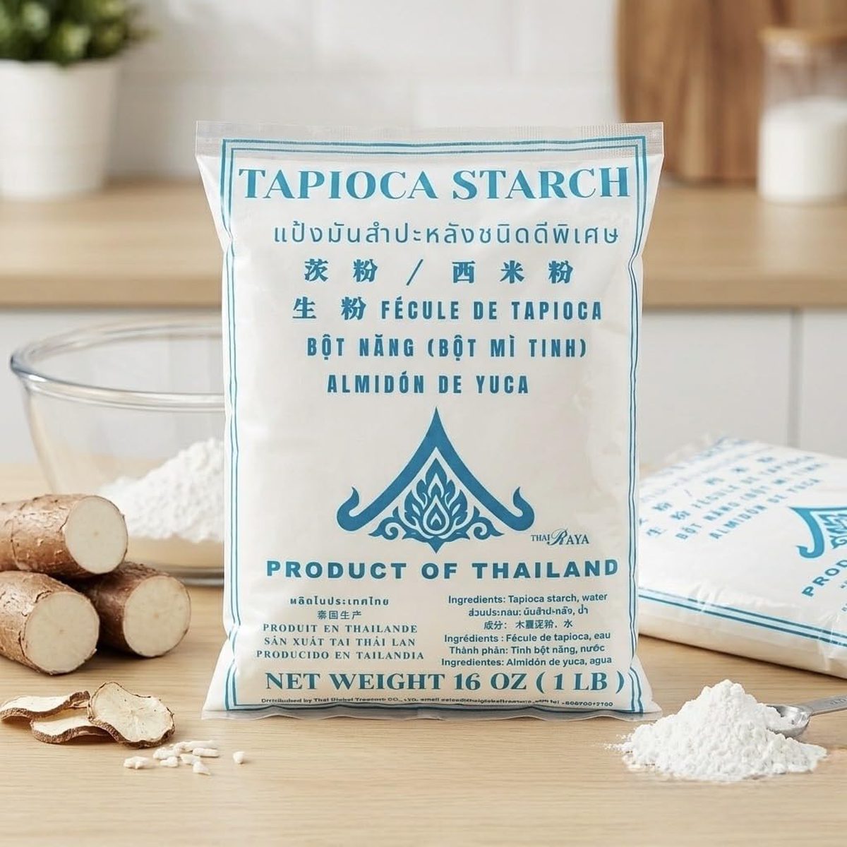 Thairaya Tapioca Starch bag beside fresh cassava roots